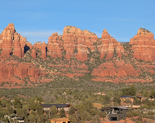 The distinct bell-shaped red rock formation of Bell Rock under a clear blue sky.