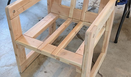 Unfinished pine patio chair made from 2x4 boards.