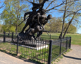 A bronze sculpture of three Confederate infantrymen—one wounded and one holding a flag—representing the Louisiana State Memorial.