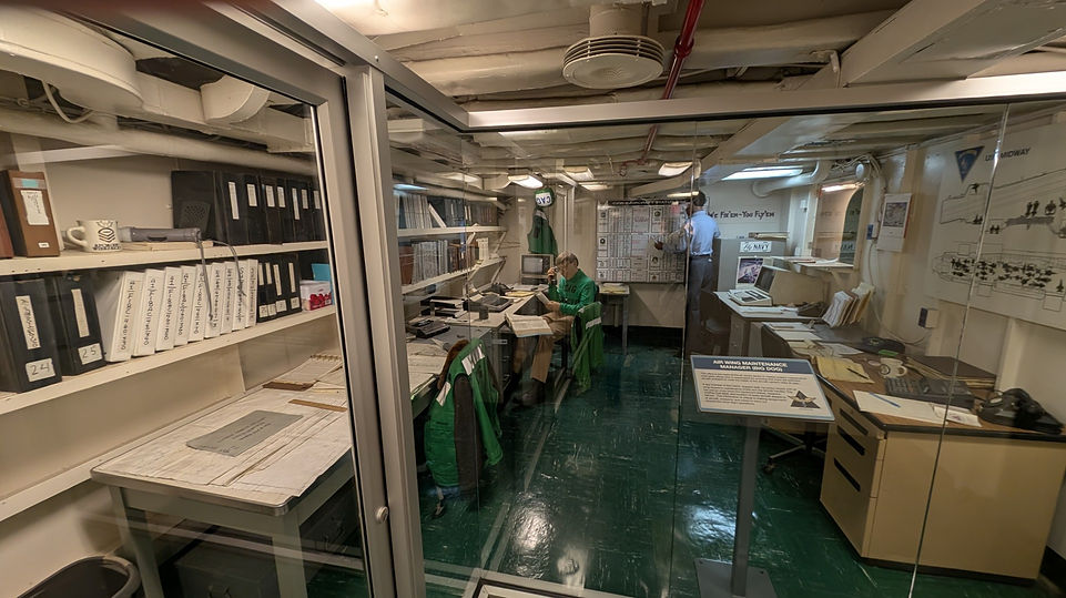 USS Midway Flight Maintenance Office is coordinating aircraft maintenance schedules and parts requisition
