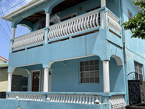 Two story tropical style light-blue house in Soufriere