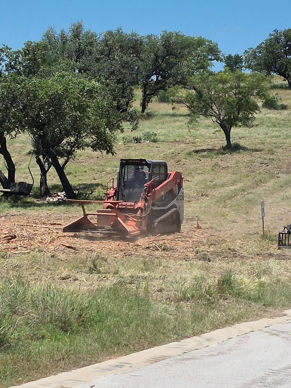 Cedar brush removal with skid steer mulcher
