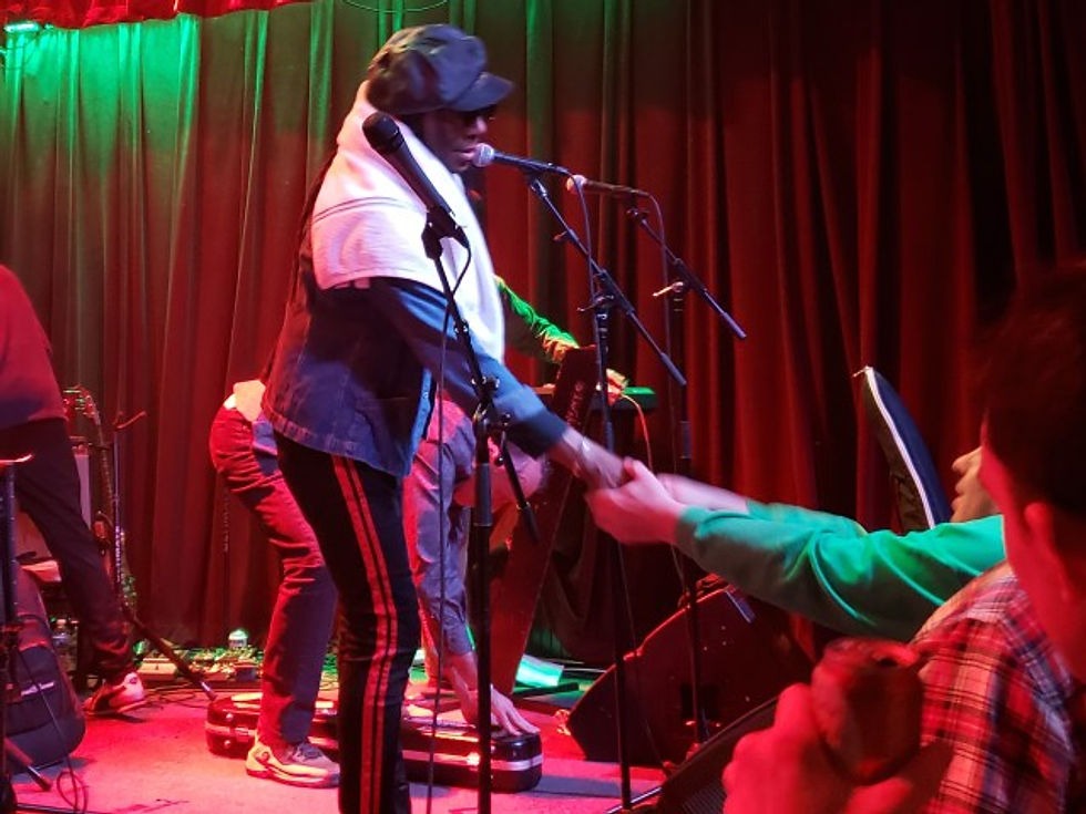 Junior Marvin shaking hands