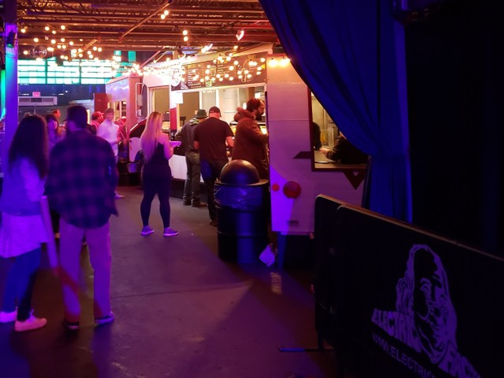 Food trucks parked inside the Electric Factory.