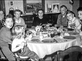 Family celebrating Thanksgiving and feeling grateful for each person at the table