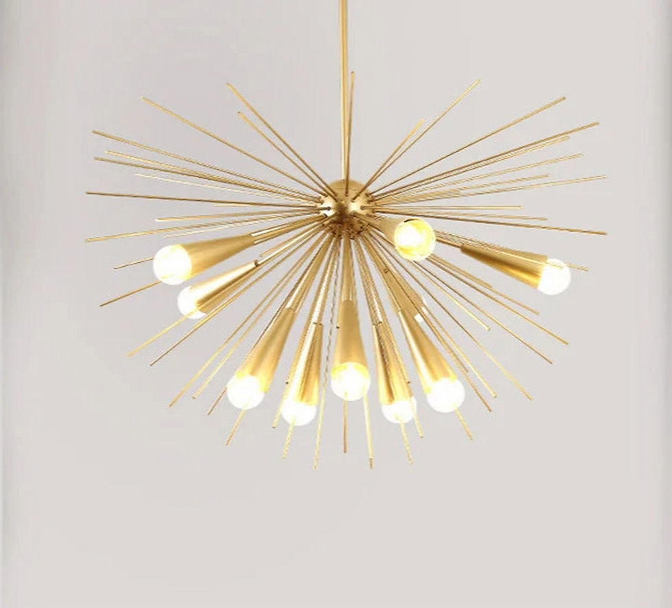 Gold sputnik chandelier with glowing bulbs on a pale background, creating a modern and elegant atmosphere.