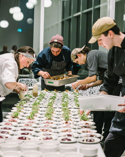 Chefs and staff plating food at the Taste of The Atlantic event.