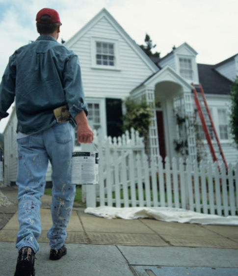 Painter walking toward house, Schedule Your Estimate