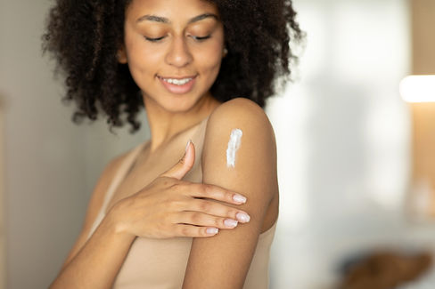 woman-applying-moisturizing-lotion-cream-her-shoulders-taking-care-her-skin-home-stand.jpg