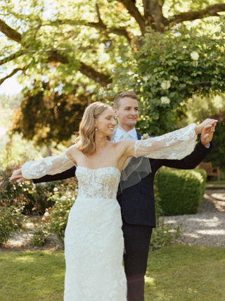 Courtenay and Matthew standing together in the vineyard at Starling Lane
