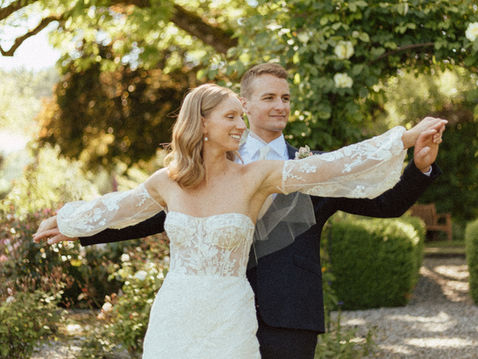 Courtenay and Matthew standing together in the vineyard at Starling Lane