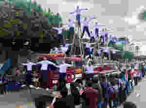firemen balancing on fire engine