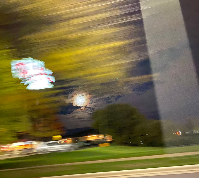 Photo taken of the moon through a moving car window