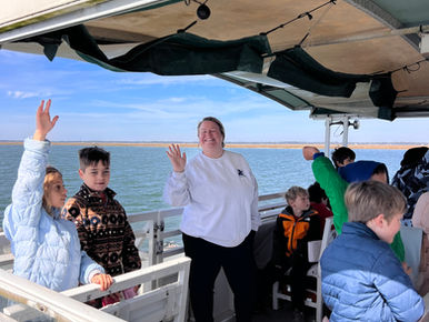 Sarah Cantrell teaching students on farm field trip.