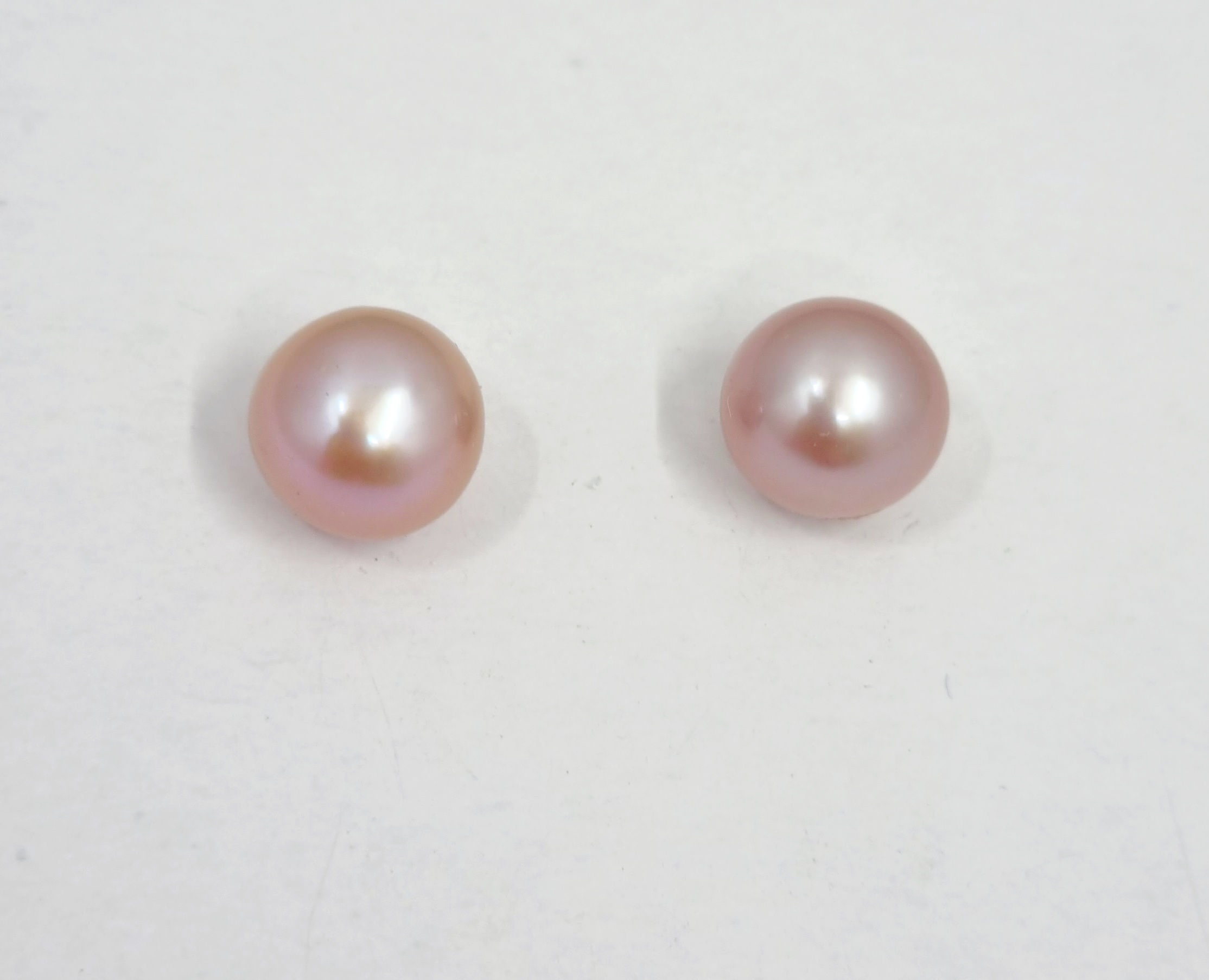 E12 Pink freshwater pearl studs, 8mm on 9cts gold settings.