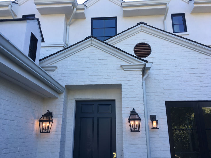 White brick exterior with black entry door, Brentwood private residence