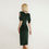 Thumbnail: Back view of the Lombard Dress in deep khaki green velvet, showing softly tailored drape and hem vent