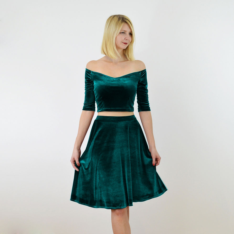 Thumbnail: Forest green velvet skater skirt styled with off-shoulder crop top, bringing a fresh, luxurious feel to seasonal dressing