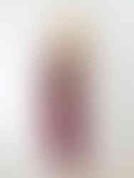 Model in velvet bralet top and matching pencil skirt