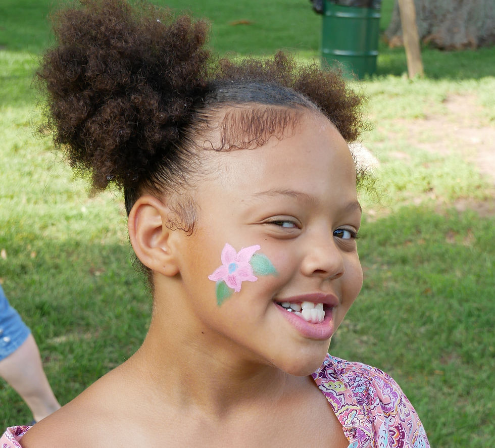 Girl with flower painted on her cheek