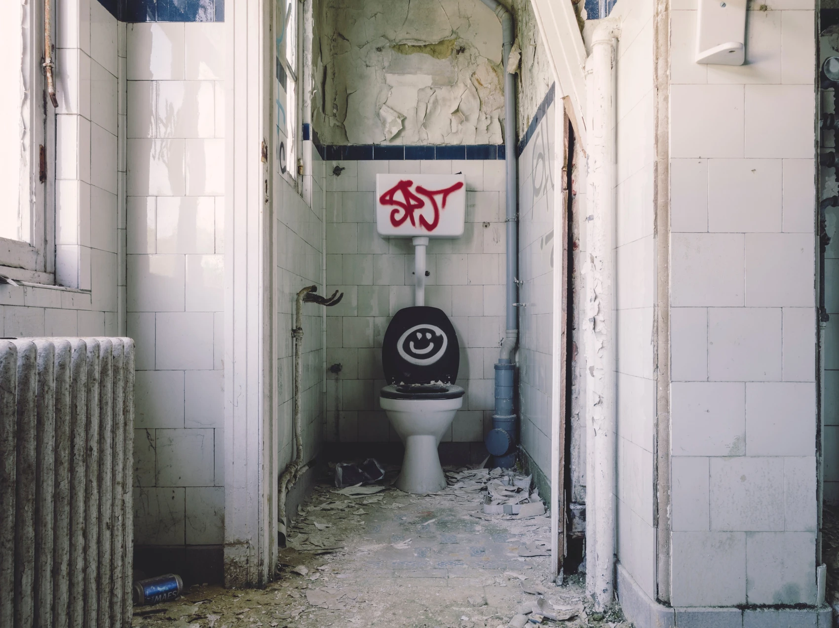 A clogged toilet and dirty bathroom