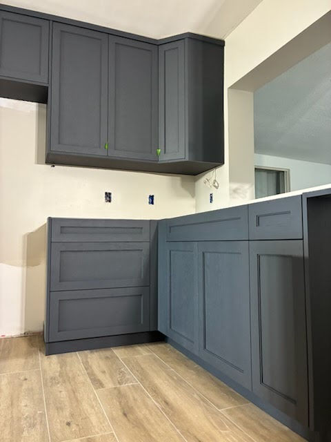 Slate blue shaker corner cabinets freshly painted and installed