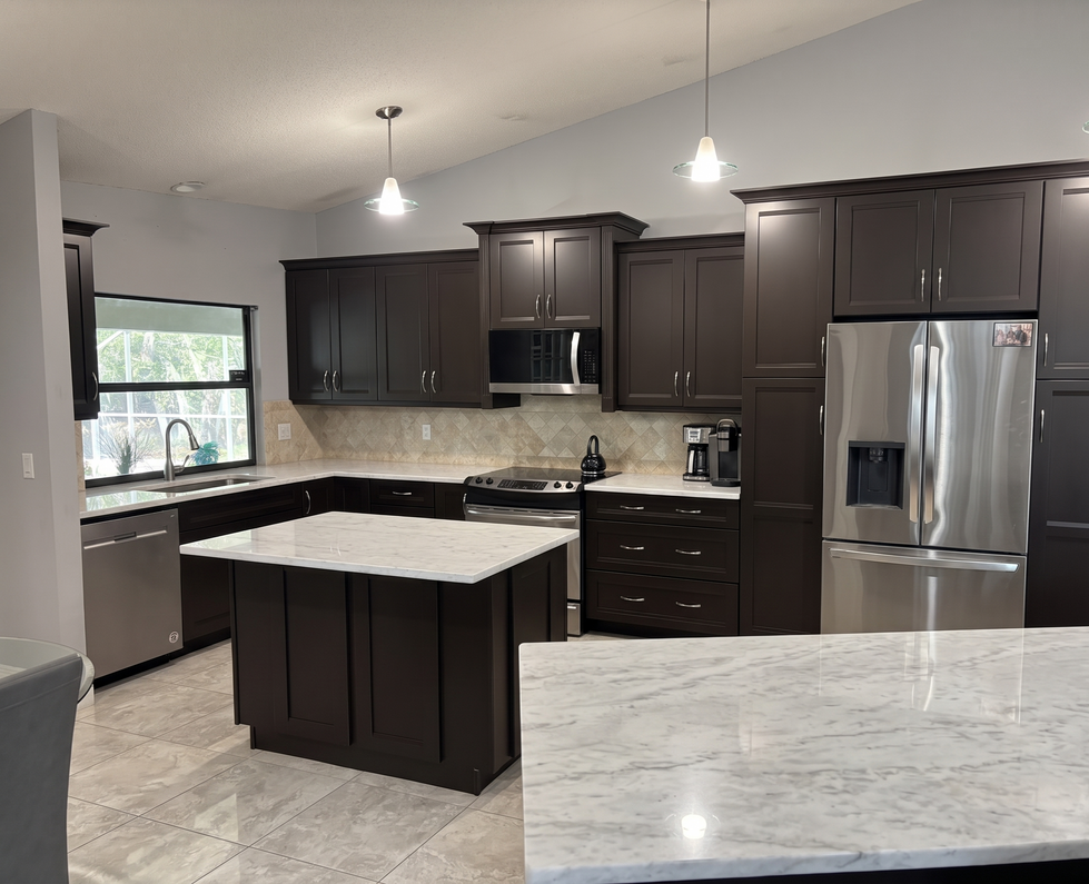 Dark espresso brown kitchen cabinets with stainless refrigerator, professionally refinished