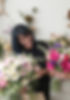 florist arranging bridal hand tied bouquet