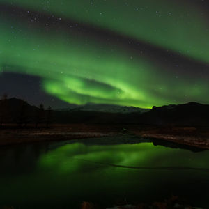 Aurora over frozen lake