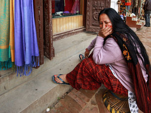 Nepalese woman cries after loss.