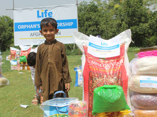 Photo of a young boy sponsored through Life for Relief and Development (LIFE).