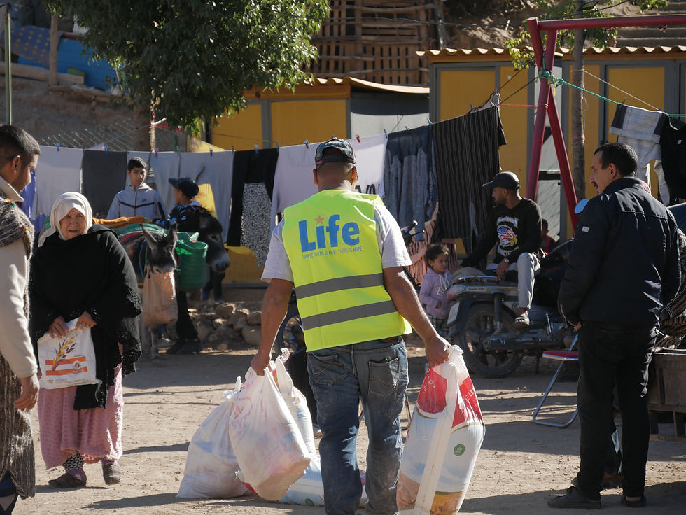 Photo of a Life for Relief and Development USA (LIFE) team member delivering essentials in Morocco.