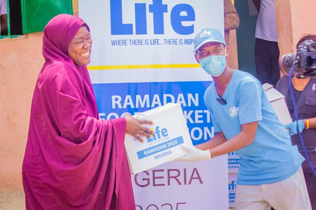 Photo of a recipient of the Life for Relief and Development USA (LIFE) food basket distribution in Nigeria.