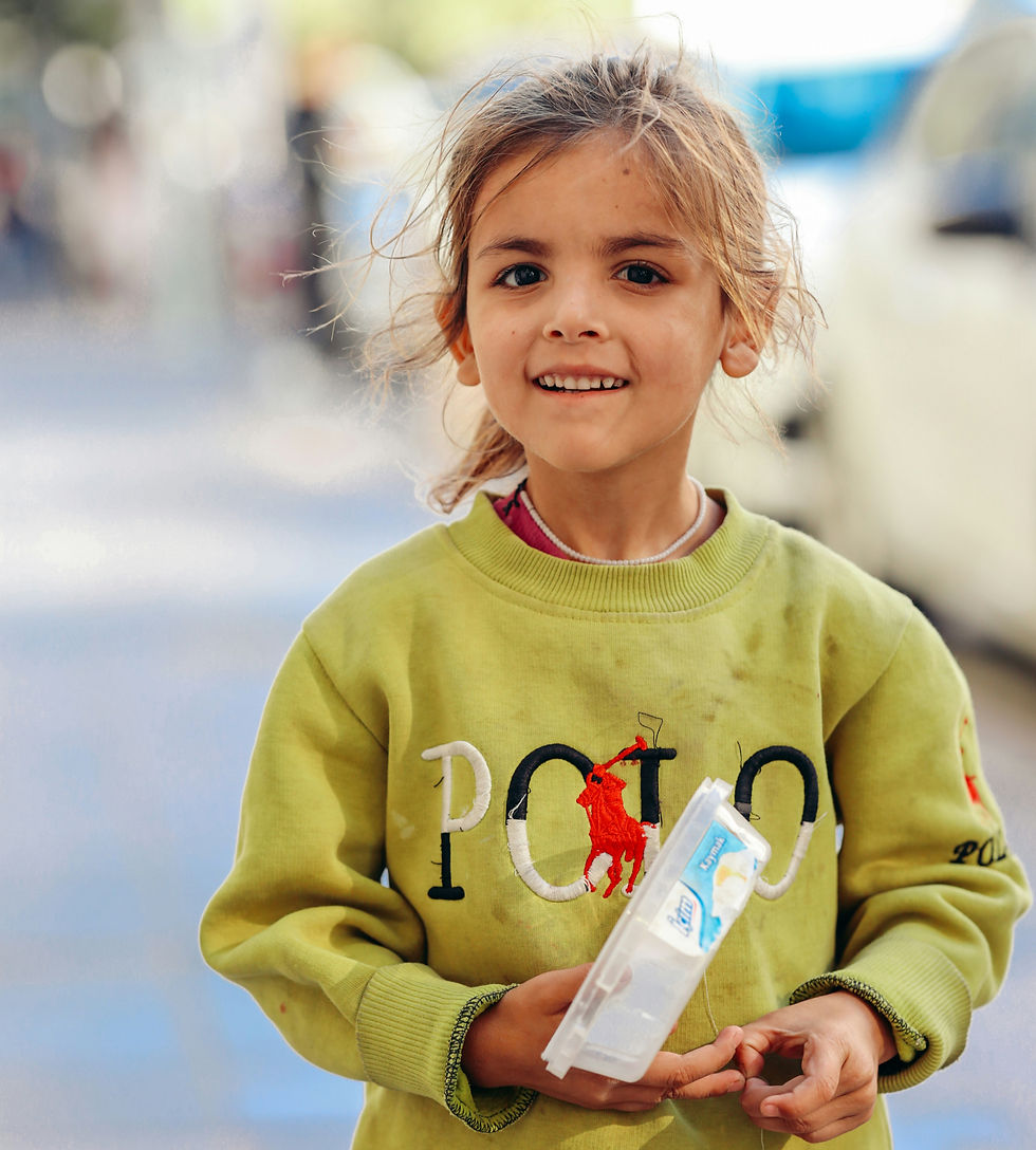 Photo of a young girl smiling.