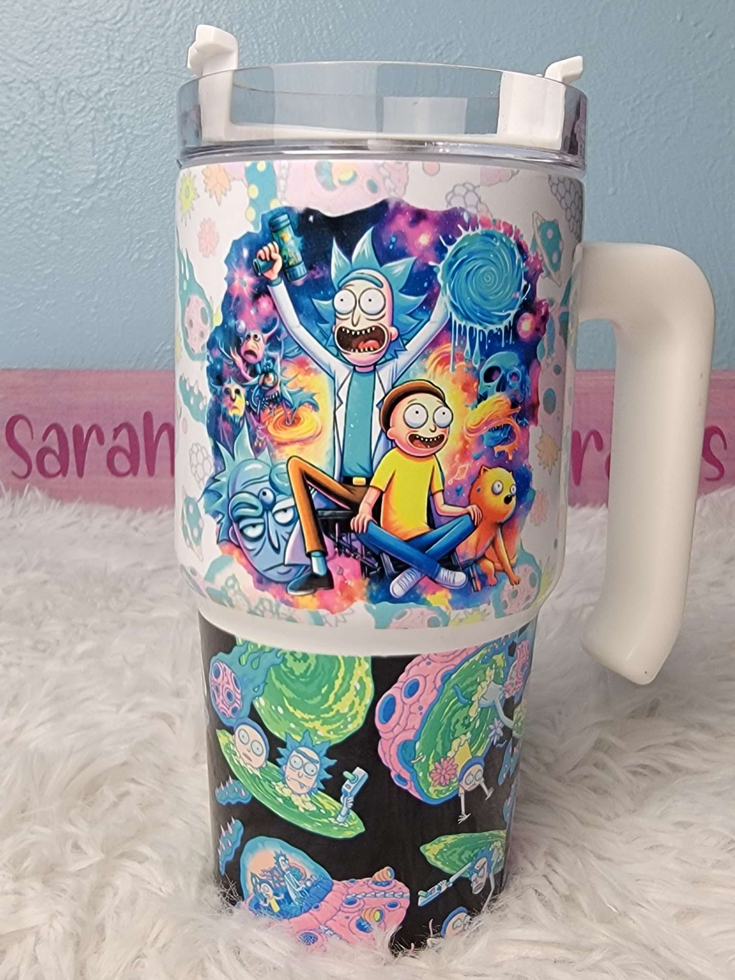 Rick and Morty 20oz stainless steel cup with side handle. Comes with a straw