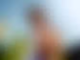 Woman hugging herself outdoors