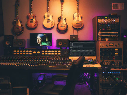 Podcast host recording an episode at a professional microphone setup to build a monetized show in 2026