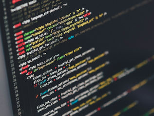 Freelance developer building a WordPress website on a dual monitor setup in 2026