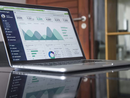 SEO specialist running a free website audit using multiple SEO tools on dual monitor setup in 2026