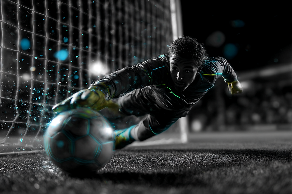srg777fnc_a_soccer_goalkeeper_diving_to_stop_a_soccer_ball_in_d80413bc-687a-4000-b69e-aad5