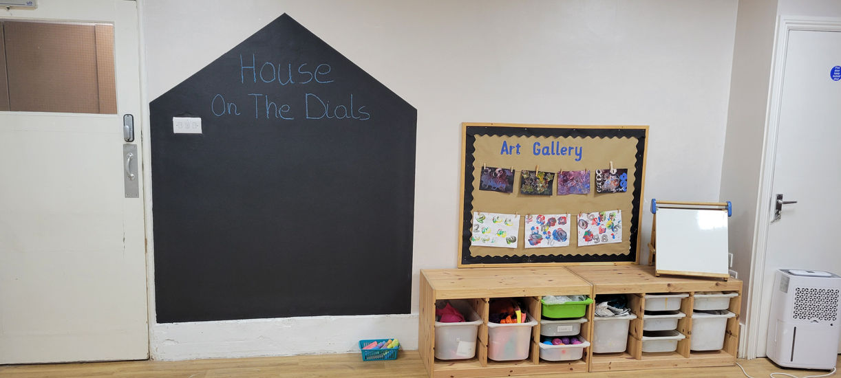 art room in a nursery showing tables, chairs, paints etc