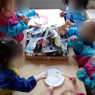 children building a papier mache volcano