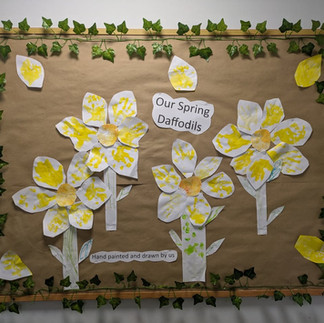 a picture of painted daffodils on a wall