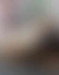 2 children at a table doing puzzles