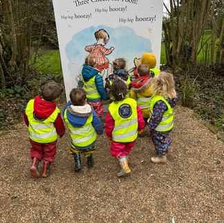 children looking at image of christopher robin