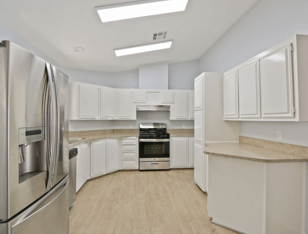 Nice kitchen with stainless steel appliances and white cabinets