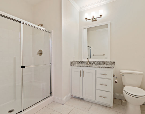 Bathroom with shower and vanity