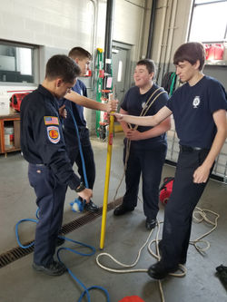 Jr. Firefighter training with tools