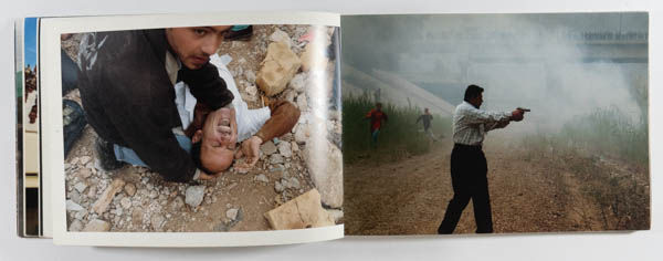 This is war is a photo book by photographer Moises Saman on mondial conflicts published by Charta, Milano, Italy,2004