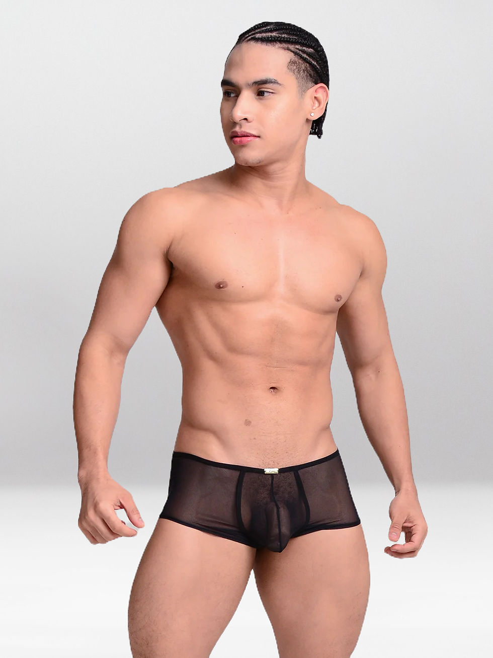 Joven posando con ropa interior negra, mirando a un lado; Simon Thong.